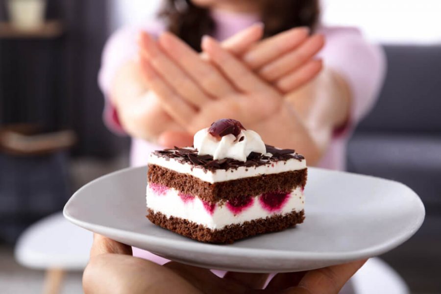 Woman saying no to cake