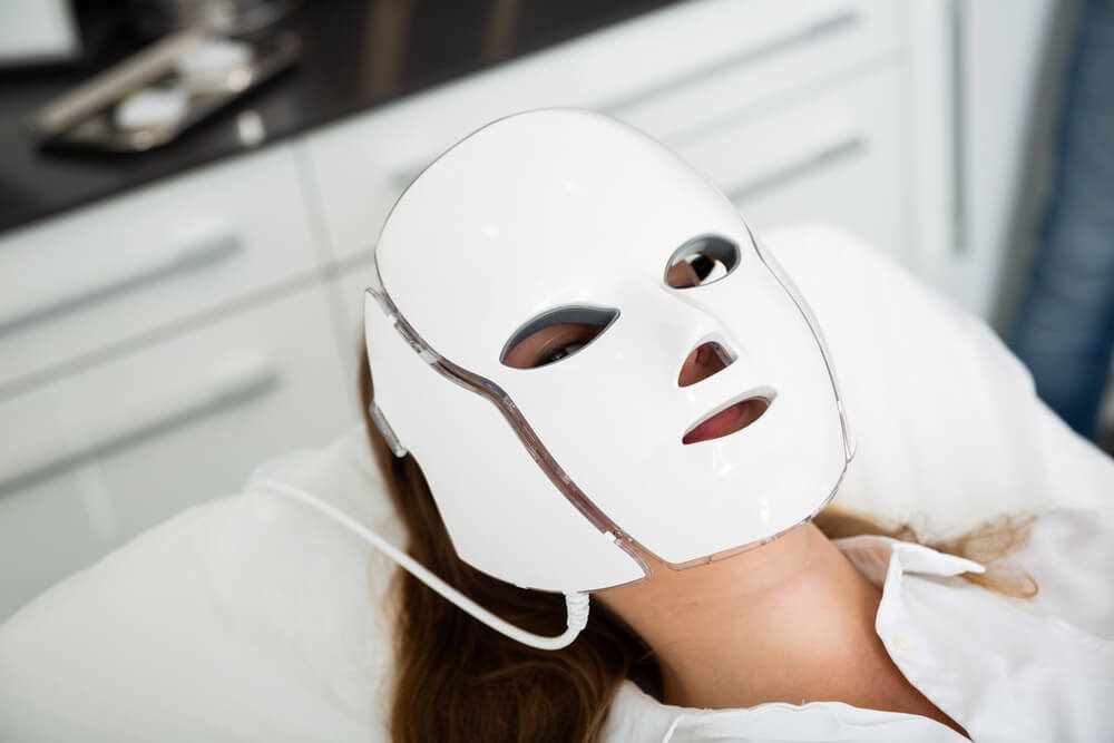Woman wearing LED mask