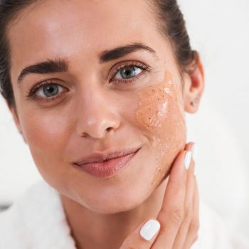 Woman applying peeling gel