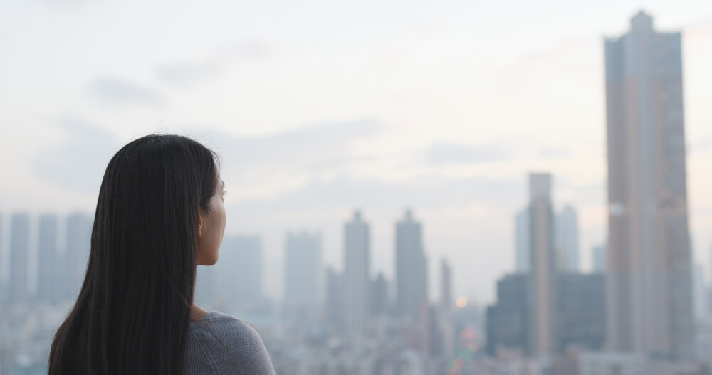 Woman looking at city