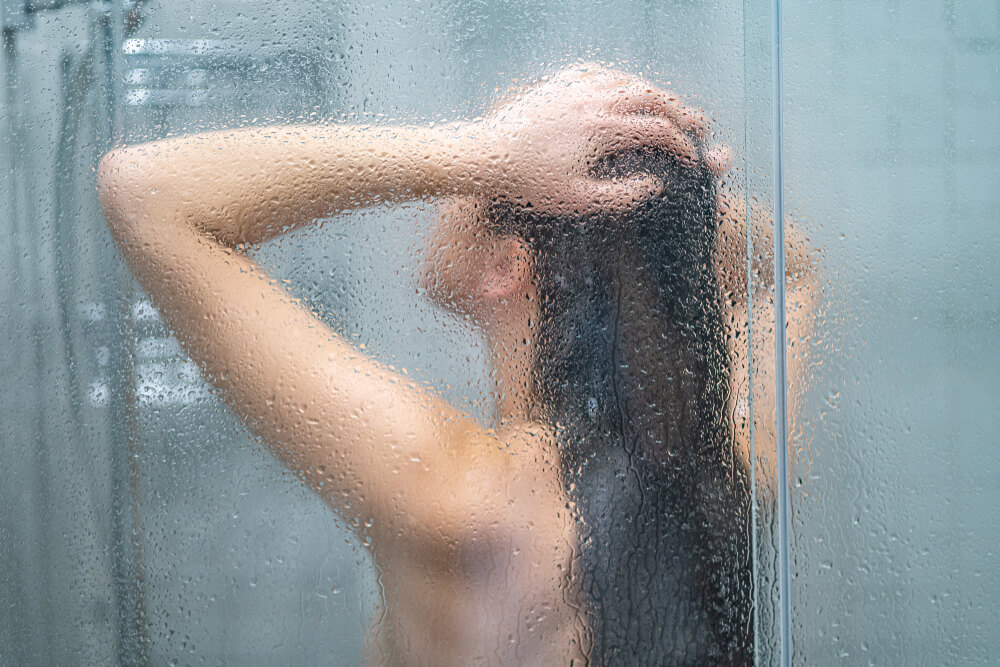woman taking hot shower