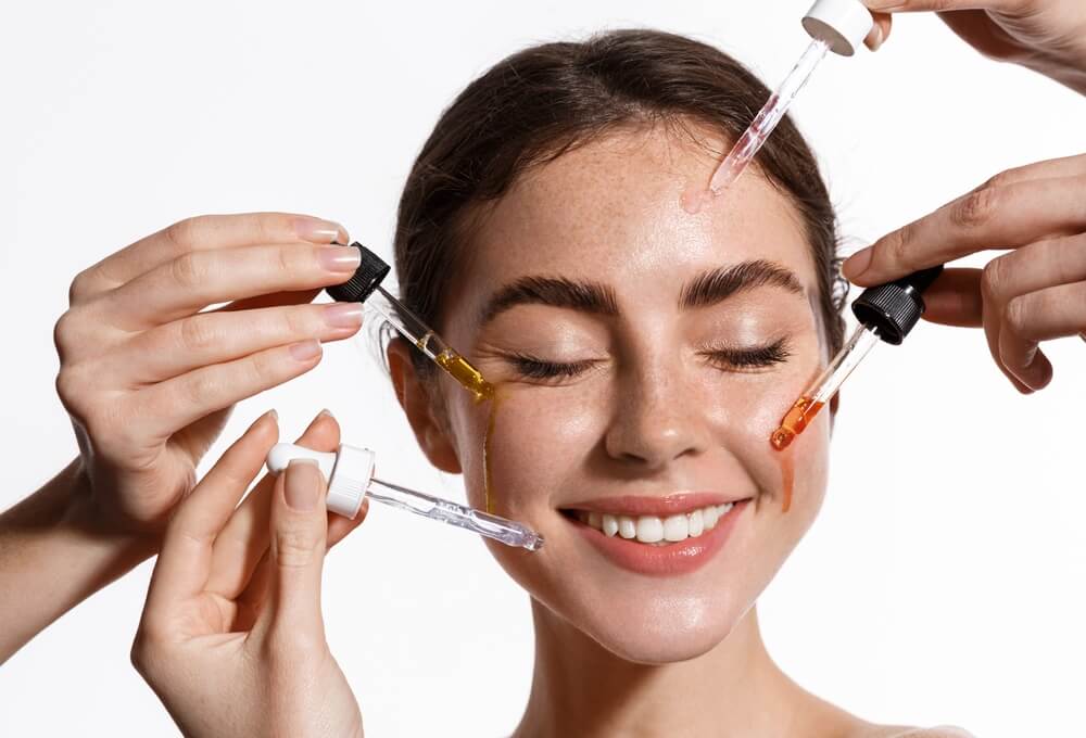 girl using multiple face serums