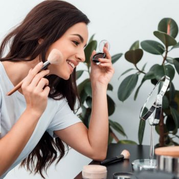 woman doing makeup